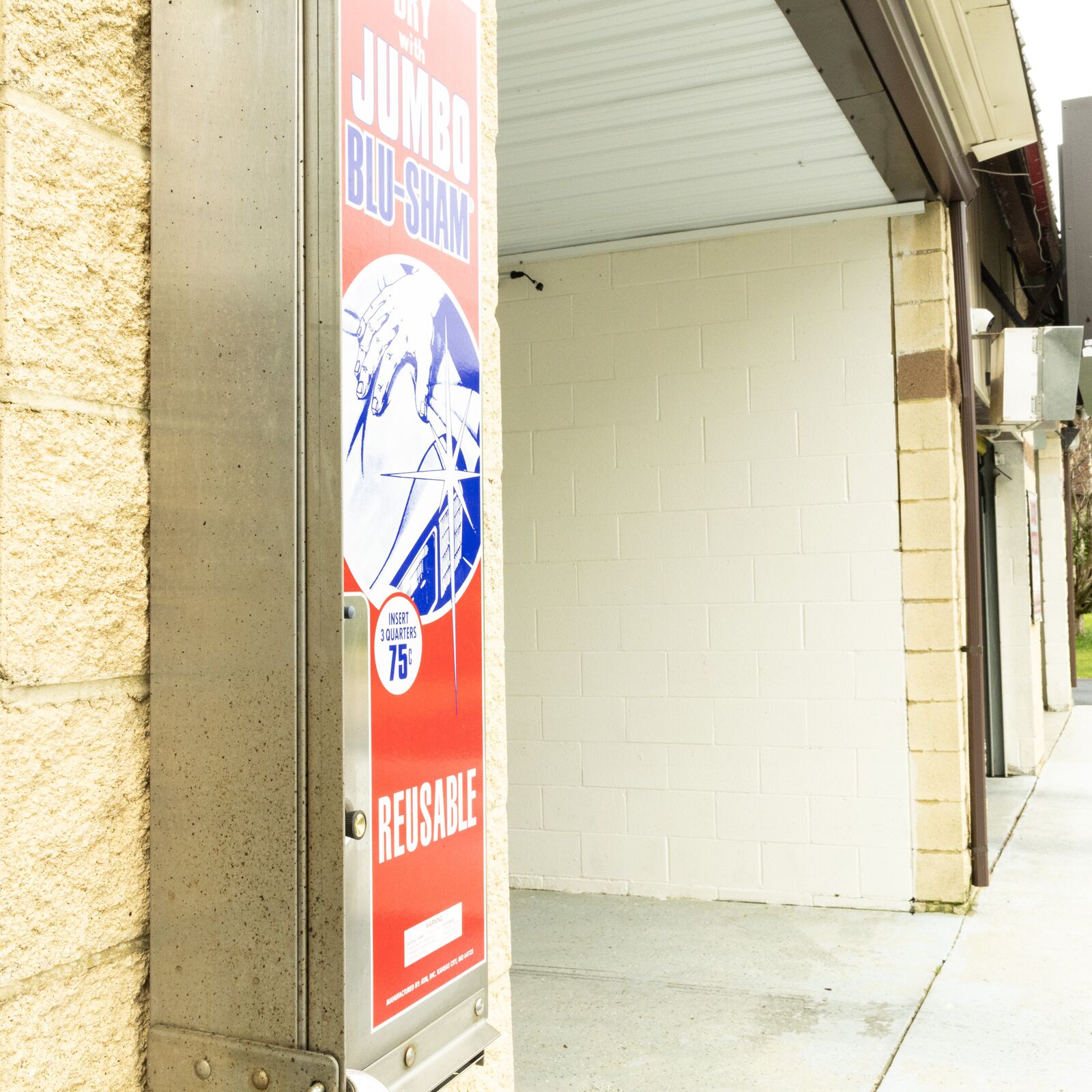 Payment sign and change machine pillar at Quick Clean Car and Truck Wash