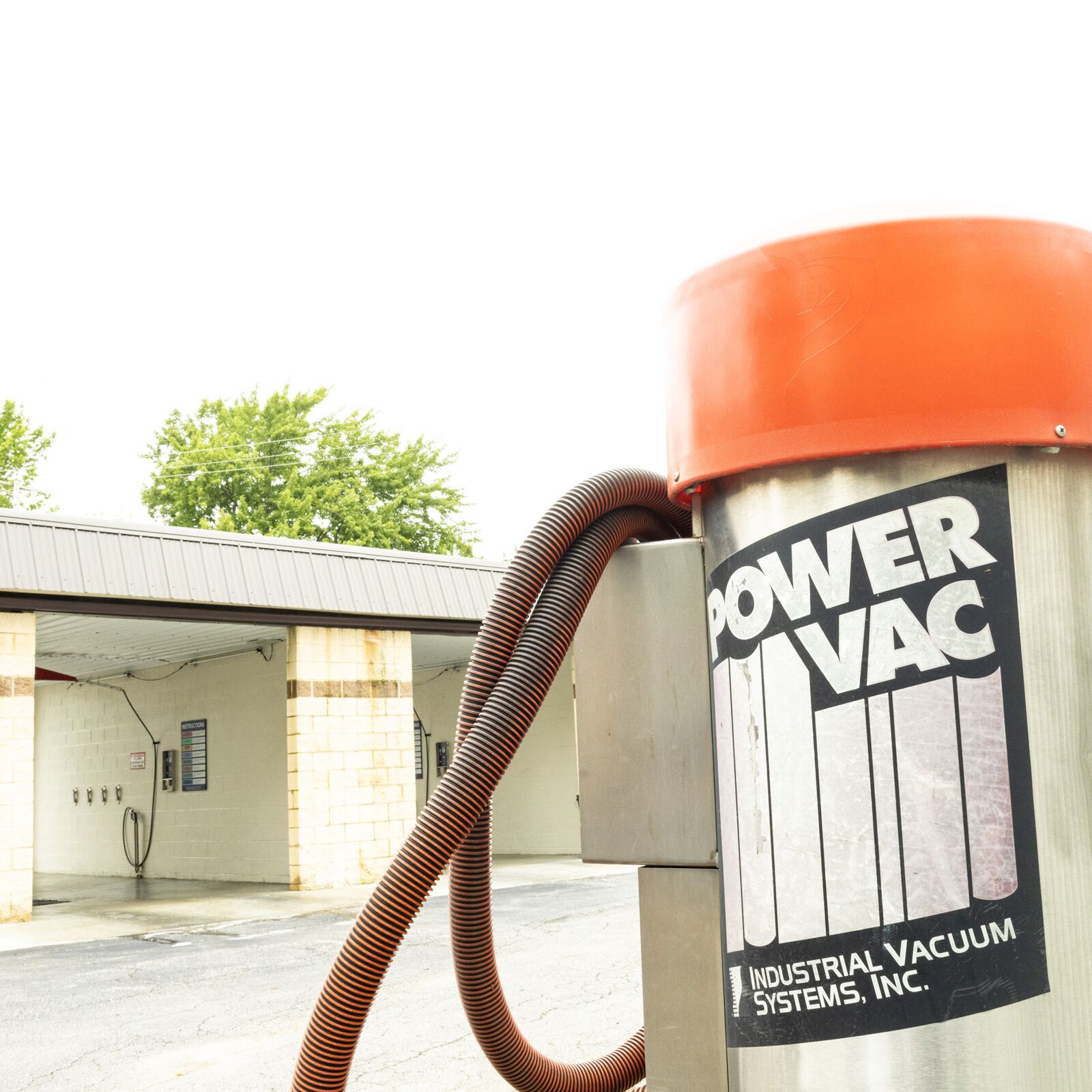 Industrial vacuum station for interior vehicle cleaning