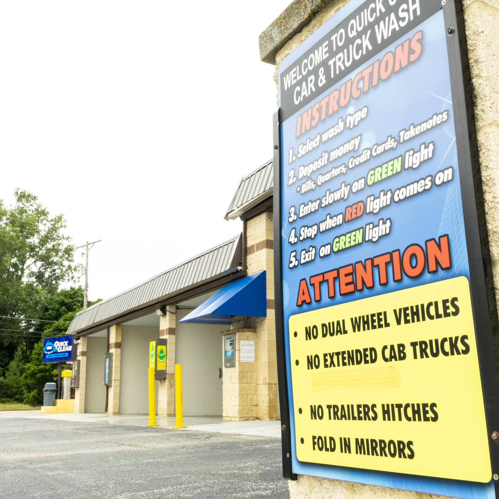 Vehicle size instructions posted at the wash bay entrance