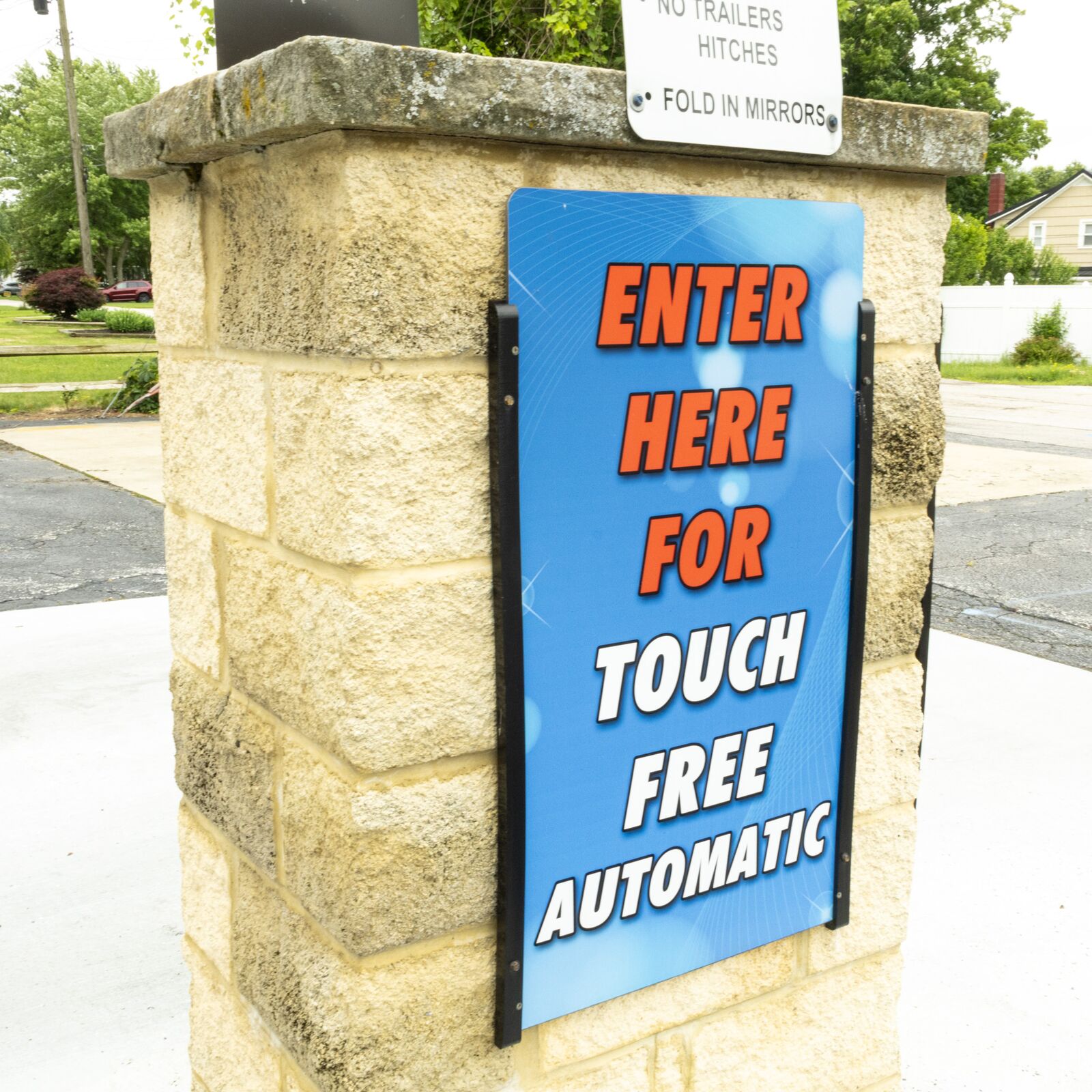 Touch-free automatic wash entrance signage close-up