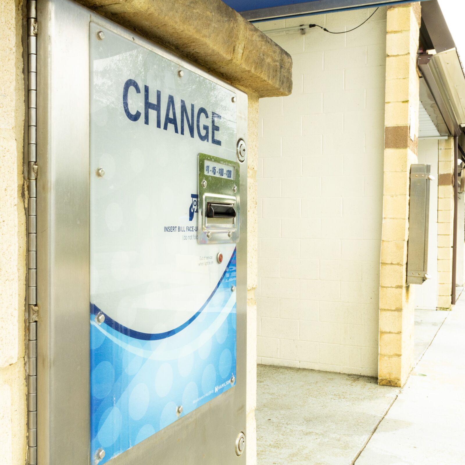Coin and card change machine for wash bay payments