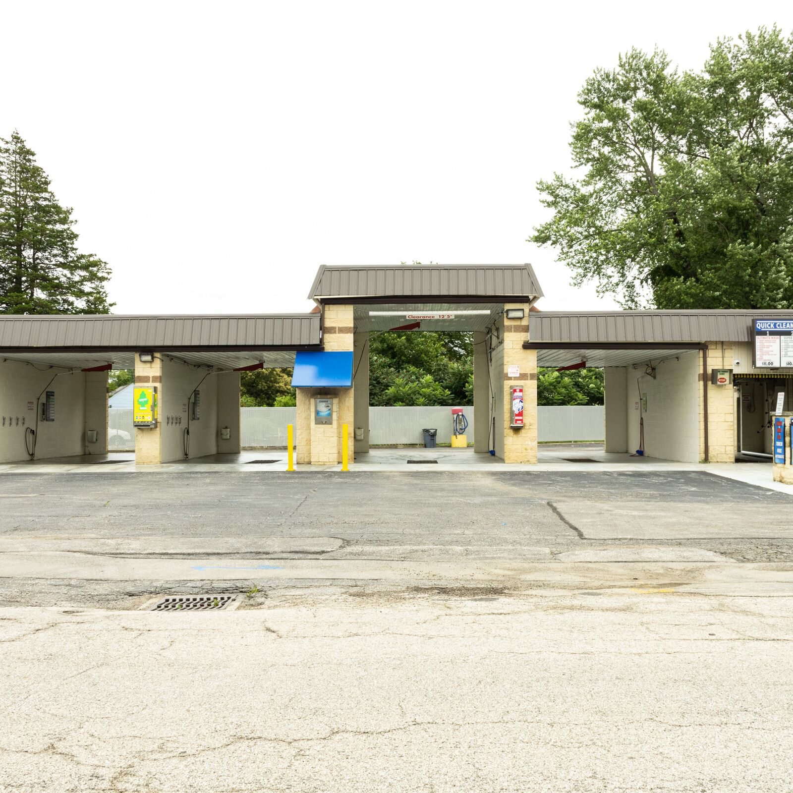 Exterior view of Quick Clean Car and Truck Wash bays and signage
